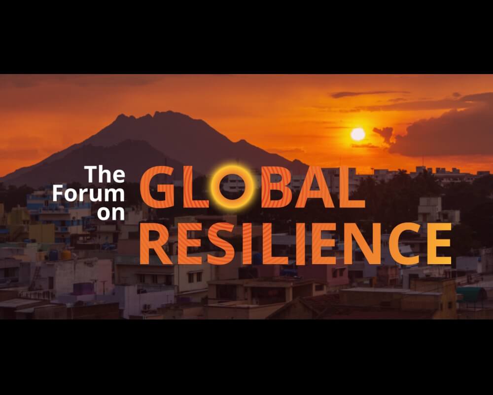 Photo of a city at sunset with the Forum on Global Resilience logo overlaid
